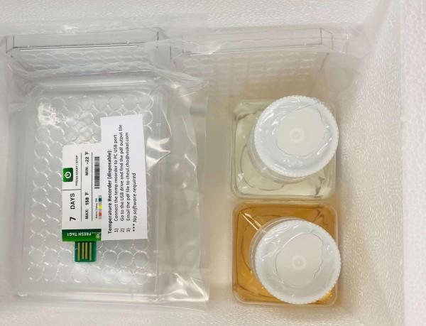 A Styrofoam box filled with Media, plate lids, and cells.